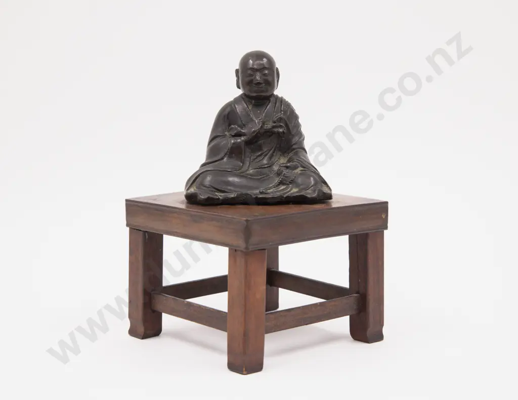 Bronze Figure of a Praying Young Tibetan Monk attached to wooden stand Image 1++