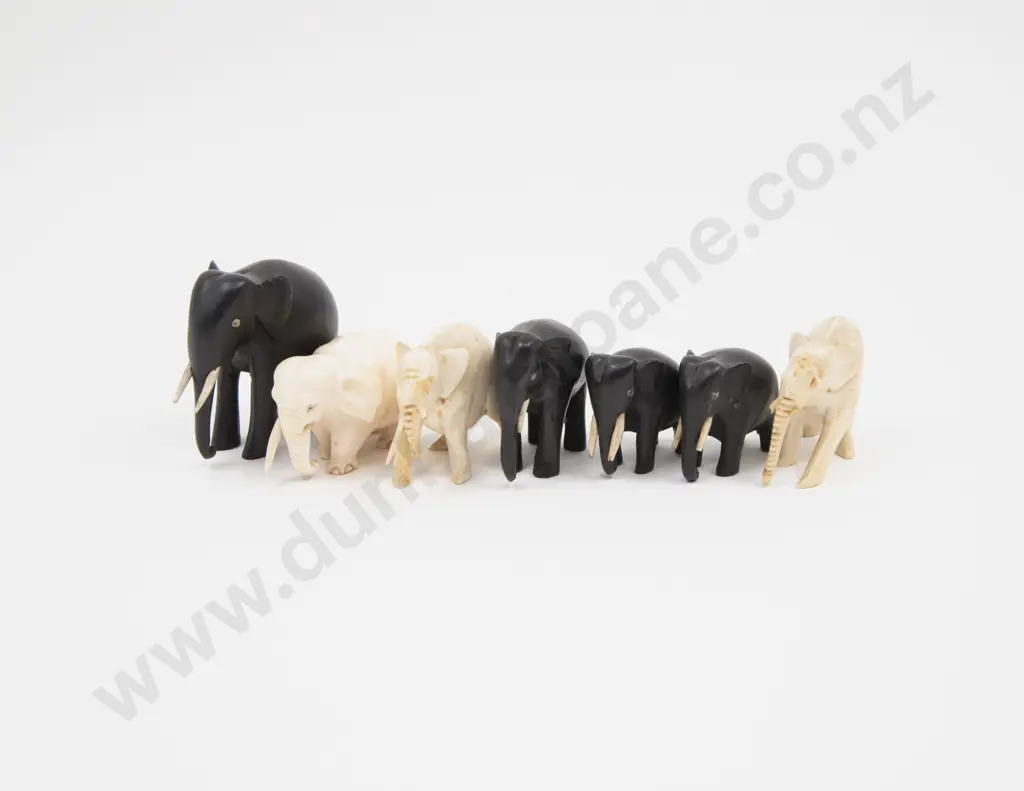 Collection of Three Ivory Elephants and Four Ebony Elephants Image 1++