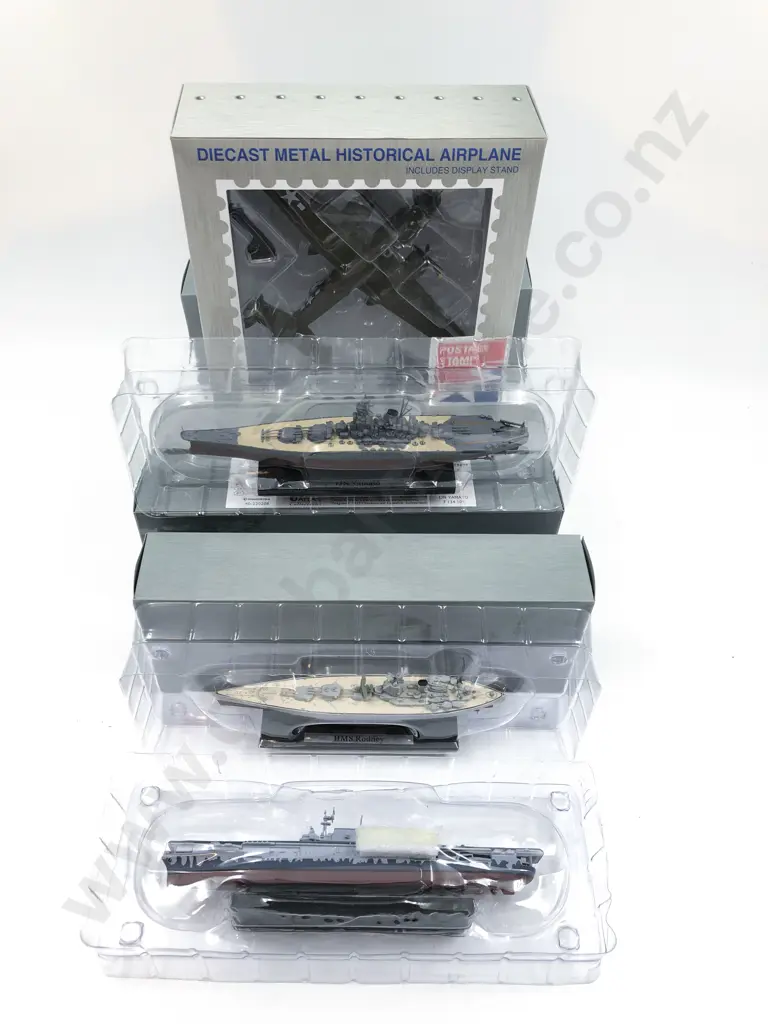Four Boxed Battleship Models and Historical Airplane Image 1++
