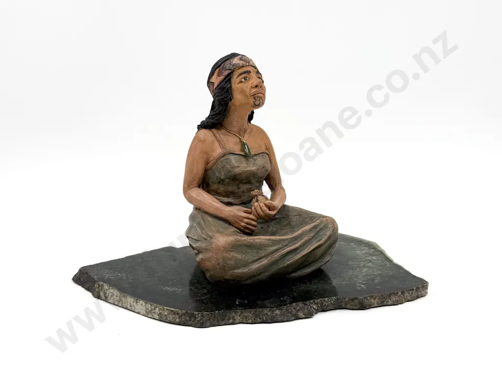 Seated Figure of Wahine on Greenstone Slab Image 1++