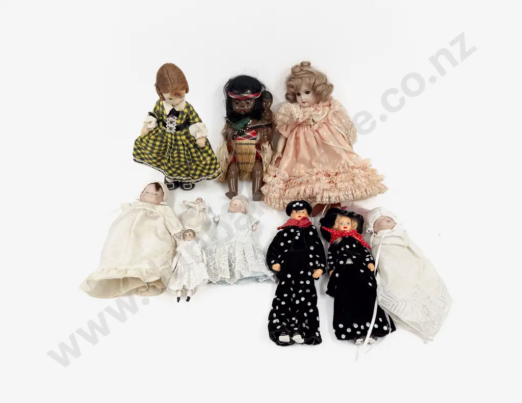 Seven Assorted Small Collectable Dolls Image 1++