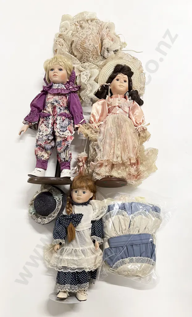 Three New Bisque Dolls with extra clothes and hat Image 1++