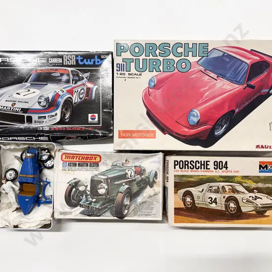 Four Assorted Vehicle Scale Model Kits and other part completed