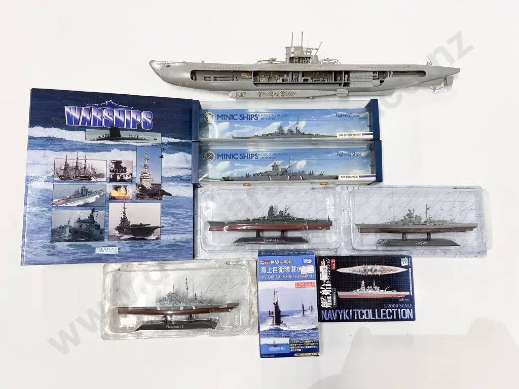 Boxed and Unboxed Eight Battle Ship Models and Reference Folder Image 1++