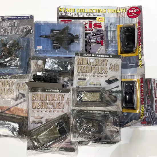 Various Magazine Model Military Craft and Two London Taxis