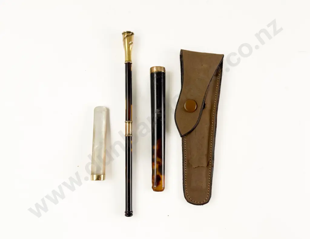 Three 9ct and 14ct Gold Mounted Cigarette Holders Image 1++