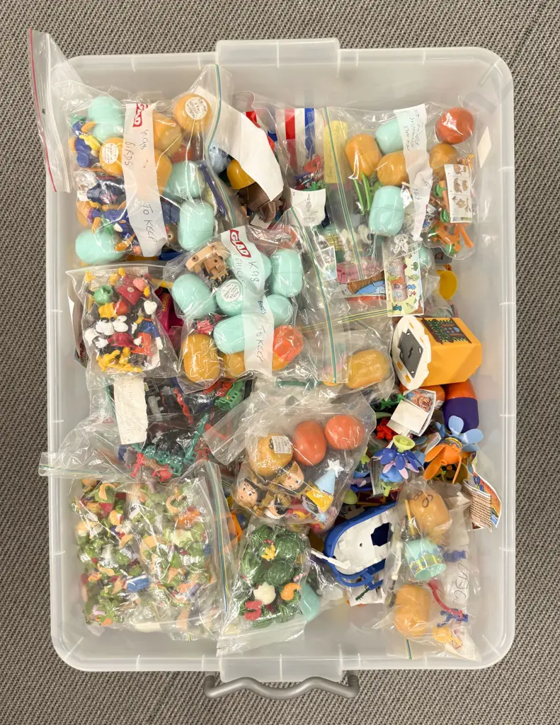 Plastic Storage Bin of Constructed Kinder Surprise Toys Image 1++