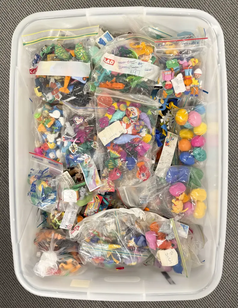 Plastic Storage Bin of Completed Kinder Surprise Toys Image 1++