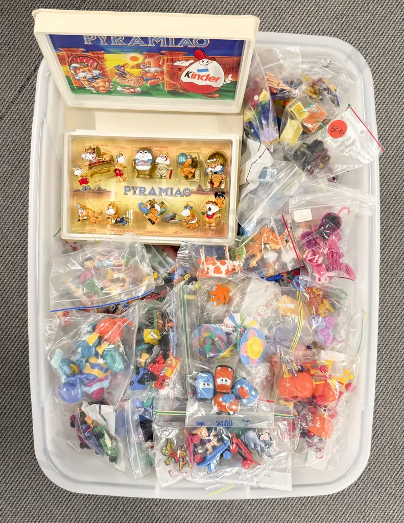 Plastic Storage Bin of Completed Kinder Surprise Toys Image 1++