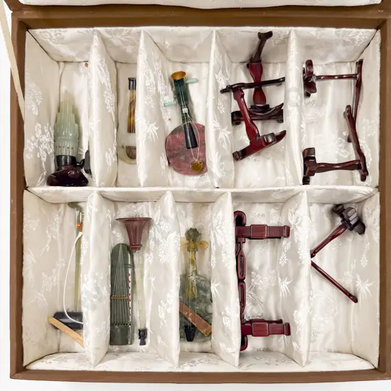 Cased Eight Agate Traditional Musical Instruments (some faults)
