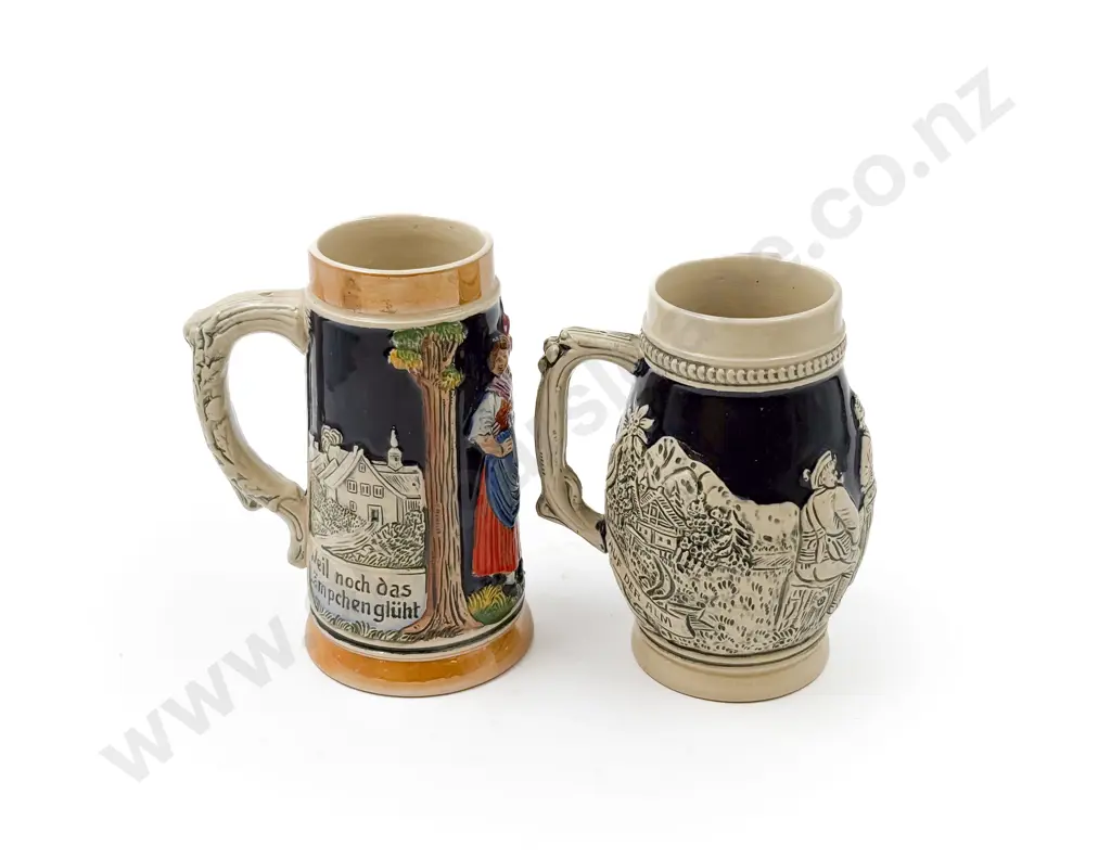 Two German Relief Molded Steins Image 1++
