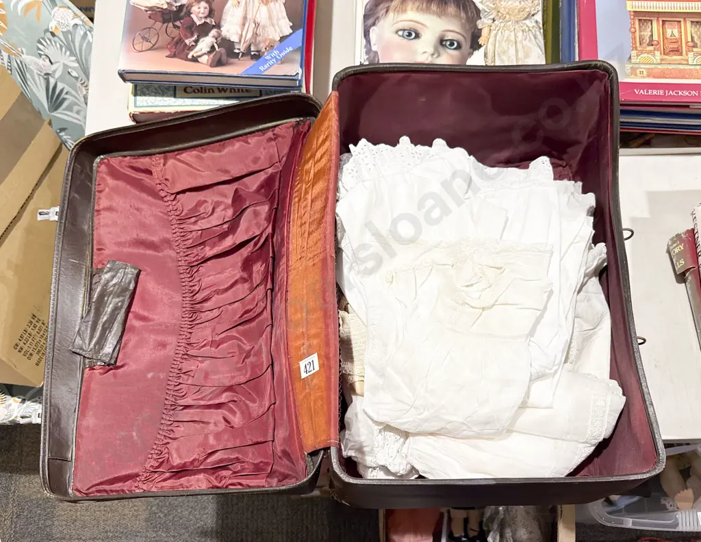 A Vintage Suitcase with Toddler & Doll White Linen & Lace Clothing Image 1++
