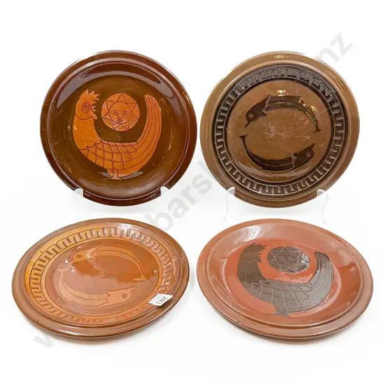 Four Fancy Pottery Plates