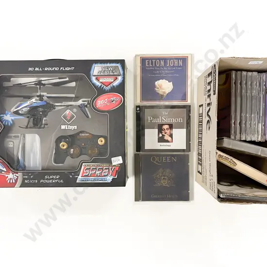 Boxed RC Helicopter together with Small Box of CDs
