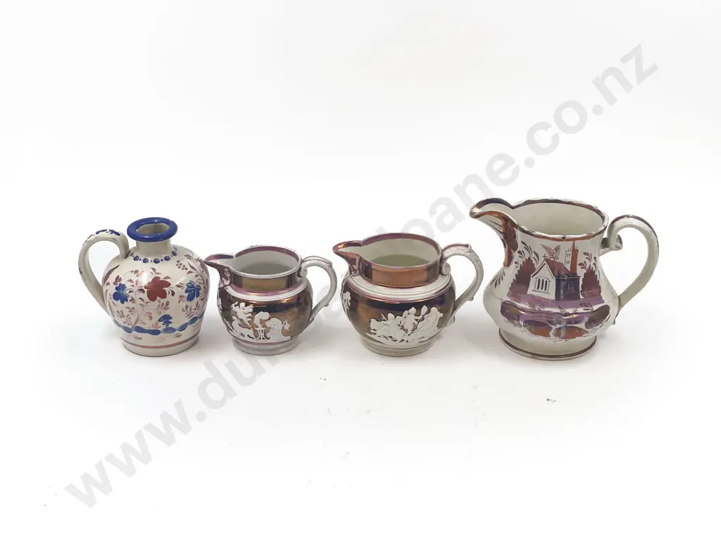 Four Copper Lustre Jugs Image 1++
