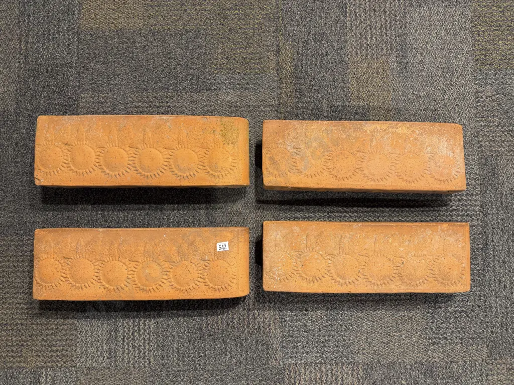 A Set of Four Slender Terracotta Planters Image 1++