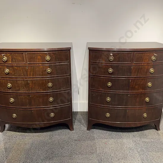 A Pair of Georgian Style Mahogany Bow Front Chests of Drawers