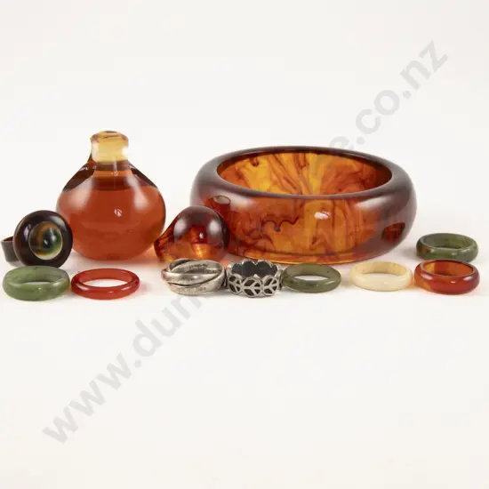 Four Amber Plastic Rings and Bangle with Three Jade Rings and Others