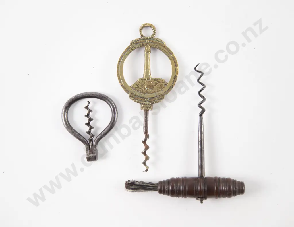 Three Vintage Corkscrews: steel on fruitwood turned handle with brush Image 1++