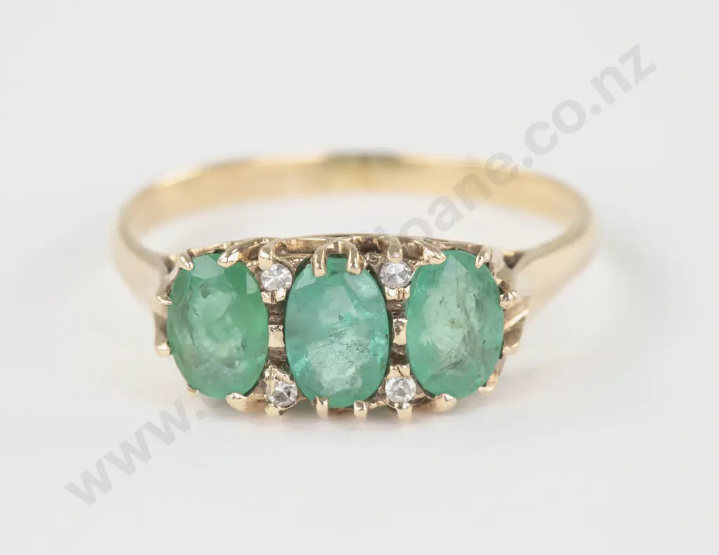 9ct Seven Stone Emerald and Diamond Bridge Ring Image 1++