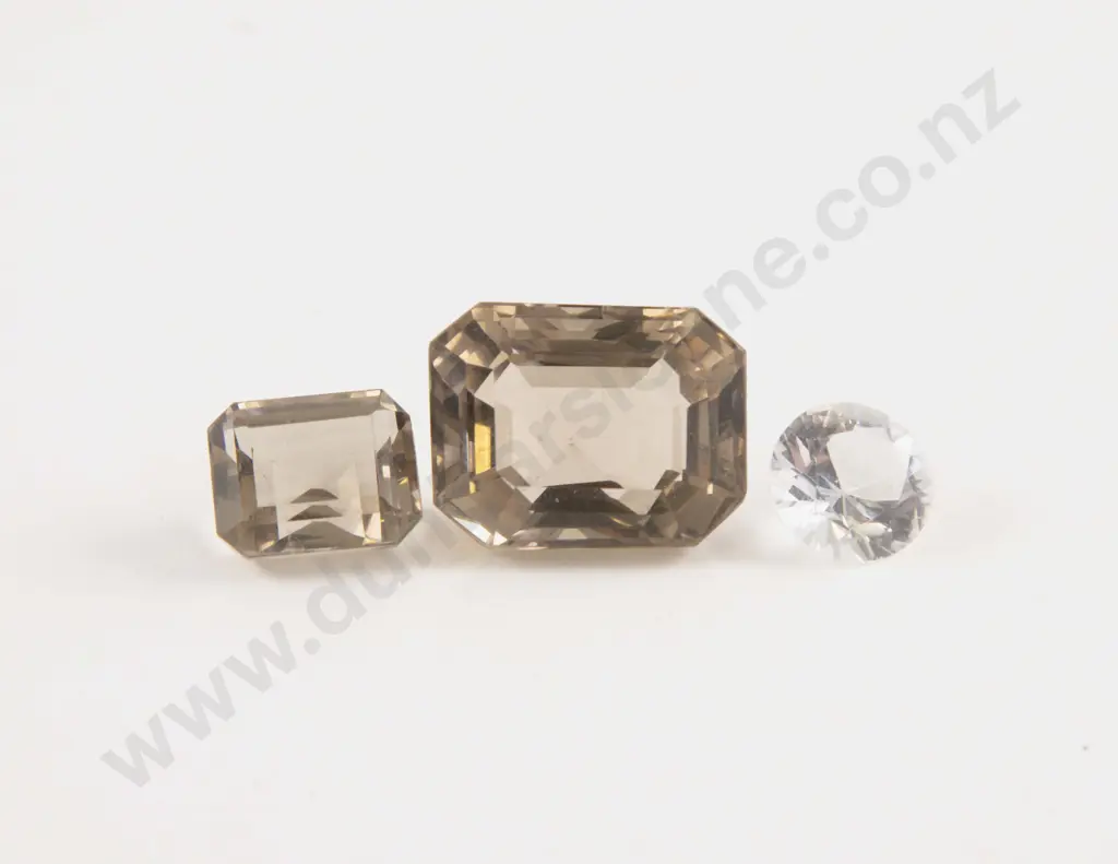 Three Unmounted Smoky Quartz and Crystal Gems Image 1++
