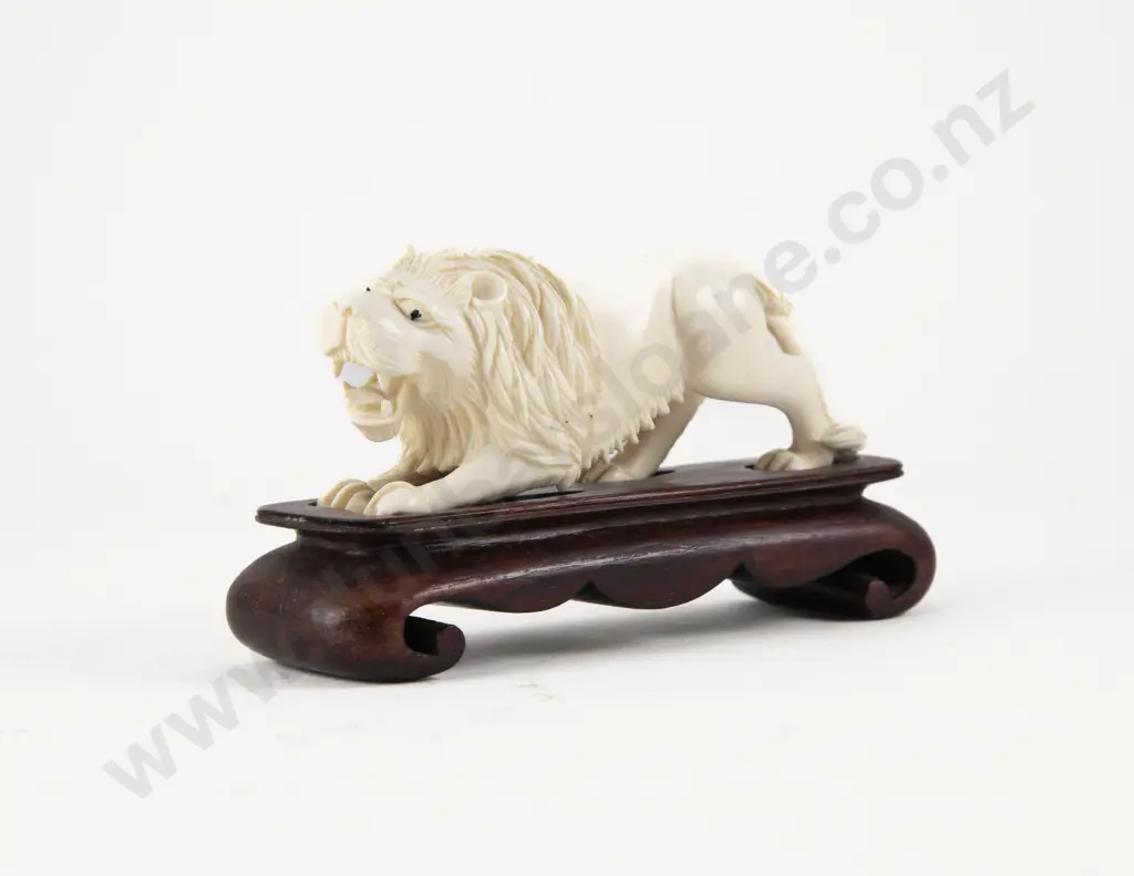 Carved Ivory Lion on Stand Image 1++