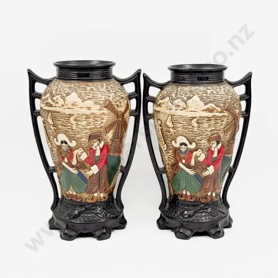 A Pair of Relief Molded Mantle Vases