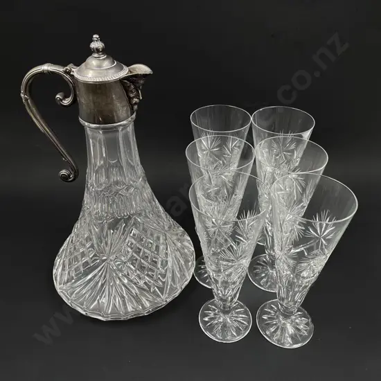 A Claret Jug together with Six Crystal Champagne Glasses