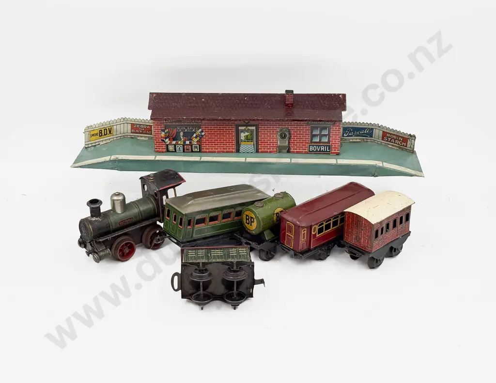 Pre-WWI Bing Clockwork Locomotive with Five Various Tinplate Wagons and Bing Station Platform Image 1++