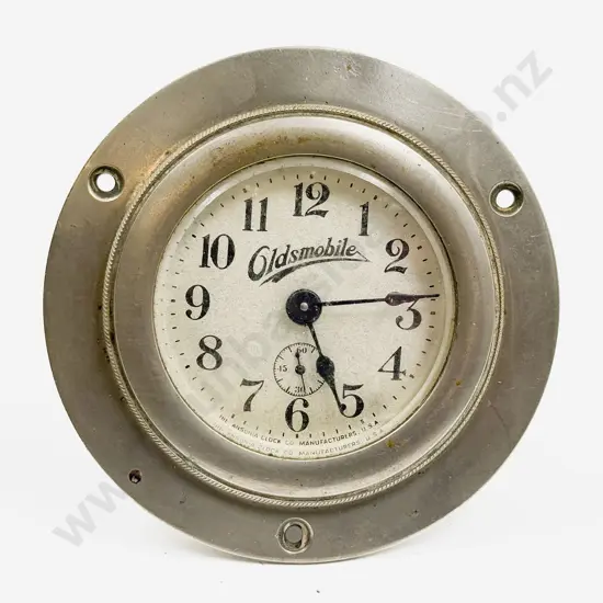 Oldsmobile White Metal Cased Lever Wind Car Clock