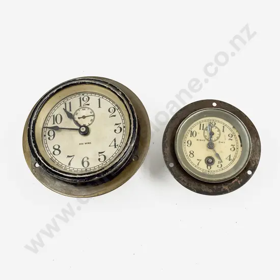 Two Unidentified Car Clocks