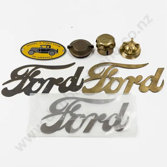Three Vintage and Replica Brass Ford Emblems and Three Caps and Ford Club Badge
