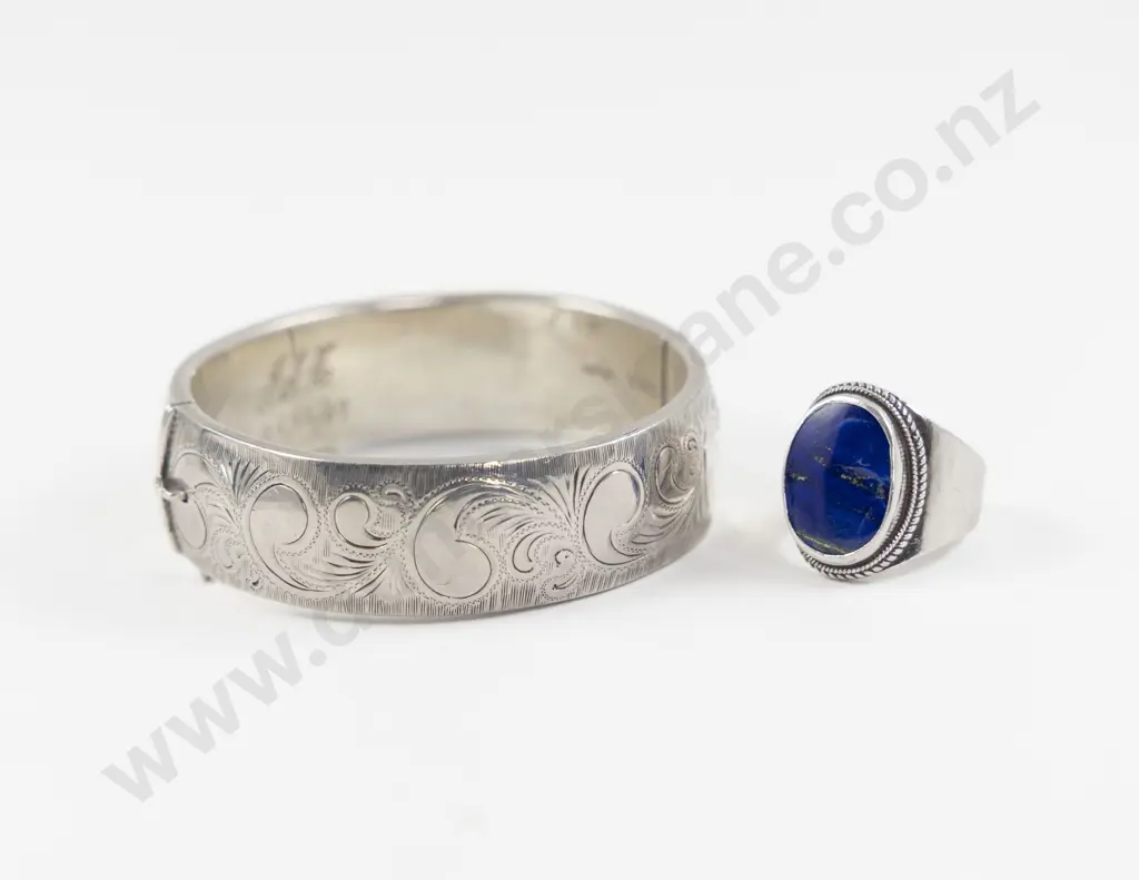 S/S Half Engraved Hinged Snap Bangle with Assorted Image 1++