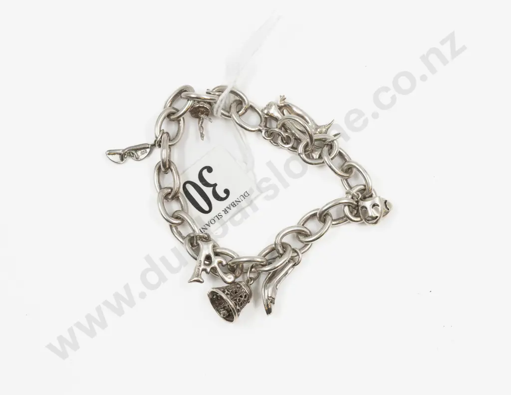 S/S Curb Link Charm Bracelet with Seven Charms Image 1++