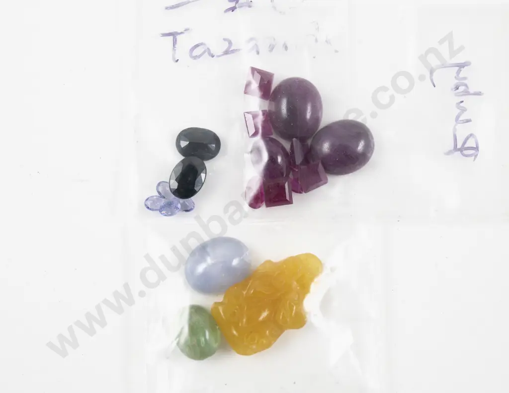 Collection of Unmounted Rubies and Other Gems Image 1++