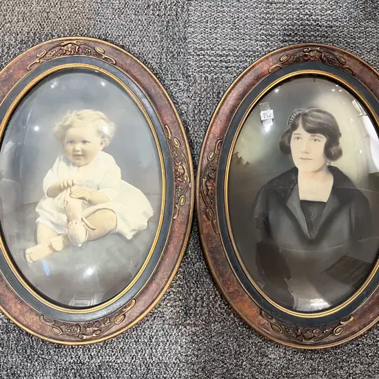 A Pair of Oval Framed Convex Portrait Prints