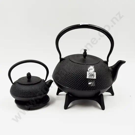 Two Wrought Metal Tea Pots and Trivets