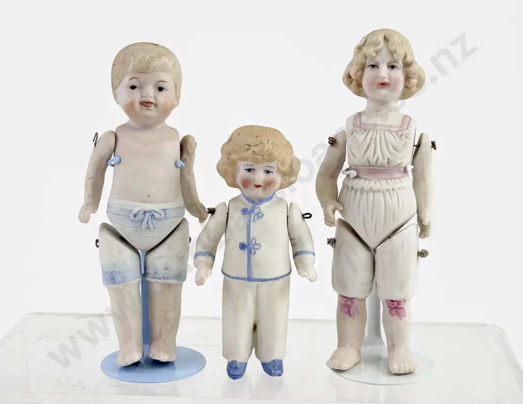 Three German and Japanese All Bisque dolls with Moulded Underwear and Pyjamas Image 1++
