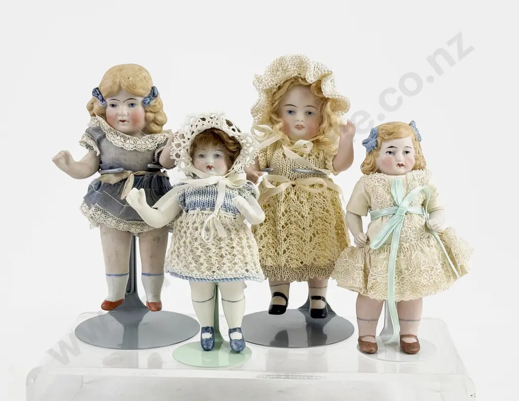 Four German All Bisque Dolls all painted features with moving arms and legs Image 1++
