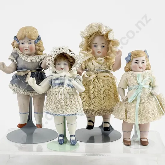 Four German All Bisque Dolls all painted features with moving arms and legs