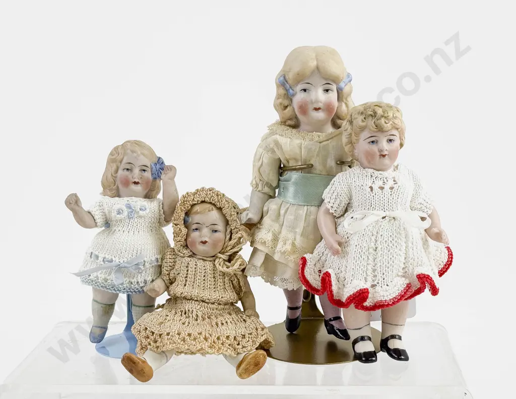 Four German All Bisque Dolls all painted features with moving arms and legs Image 1++