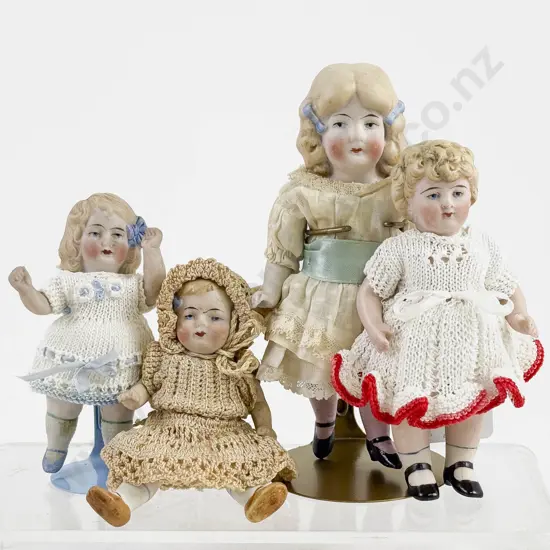 Four German All Bisque Dolls all painted features with moving arms and legs