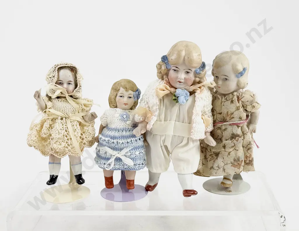 Four German All Bisque Dolls all painted features with moving arms and legs Image 1++