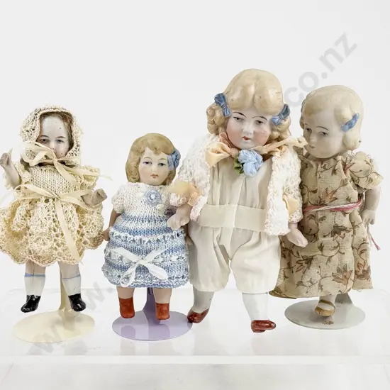Four German All Bisque Dolls all painted features with moving arms and legs