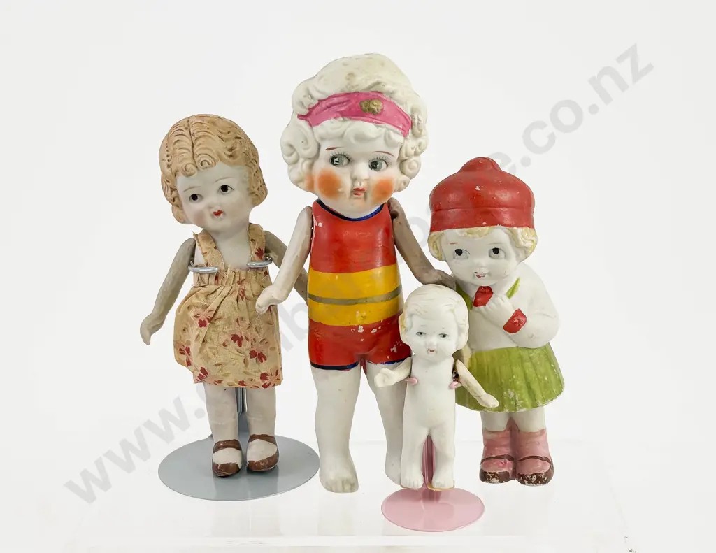 C1920's Four Japanese All Bisque Character Dolls all painted features with moving arms Image 1++