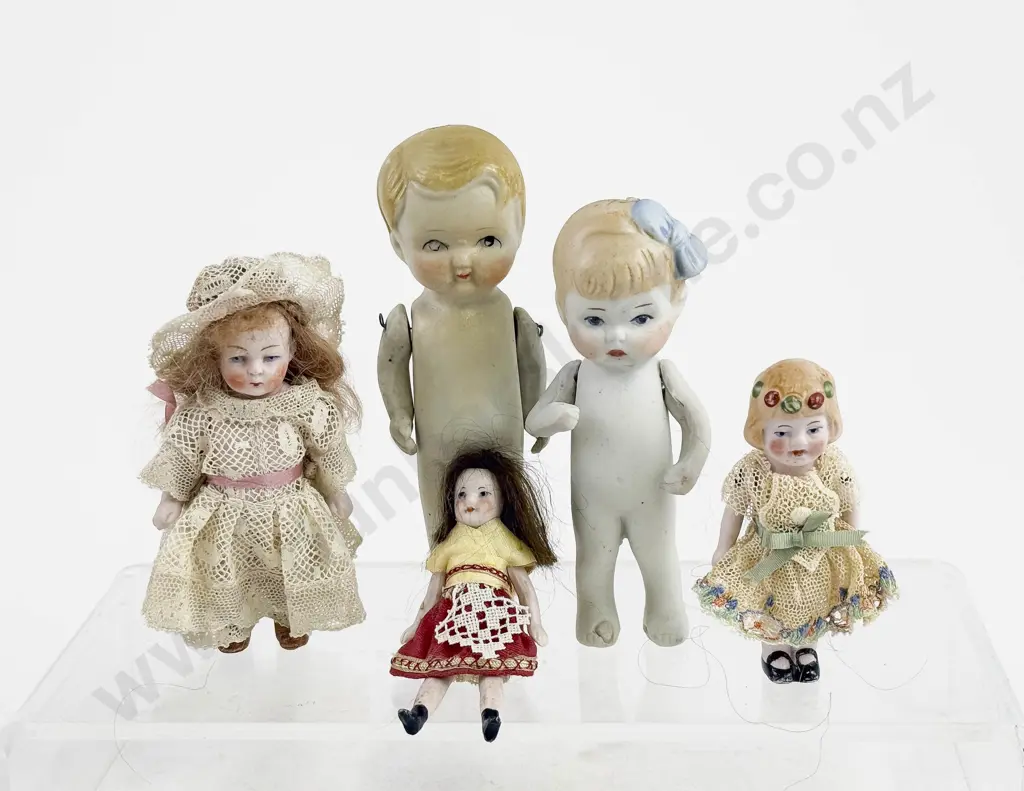 Five German and Japanese All Bisque Dolls all painted features with moving arms Image 1++