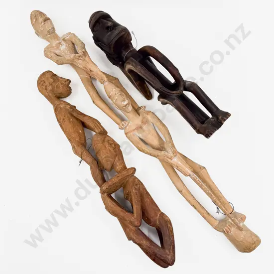 Three Assorted Carved PNG Figures
