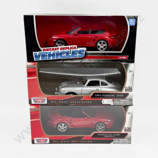 Three Boxed 1:24 Scale Porsche Models
