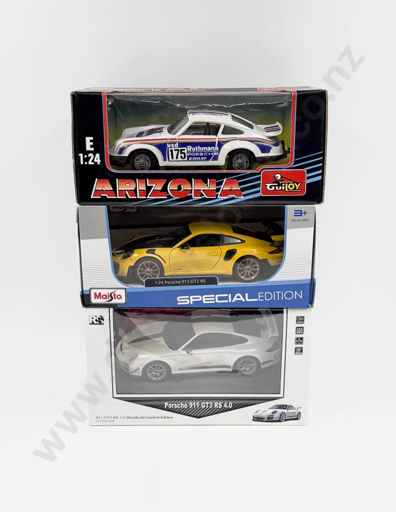 Three Boxed 1:24 Scale  Porsche Models Image 1++