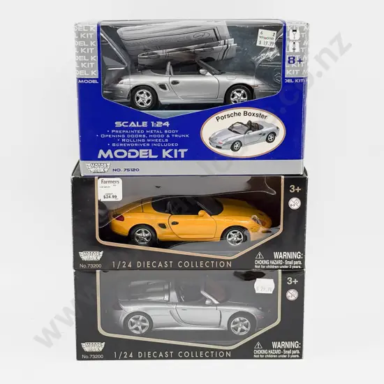Two Boxed Motor Max 1:24 Scale Porsche Models and One 1:24 Scale Porsche Model Kit